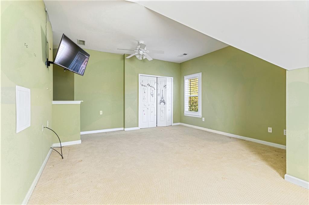 1355 Chattahoochee Run Drive Suwanee, GA 30024 - Photo 26 of 57 a view of an empty room with a window