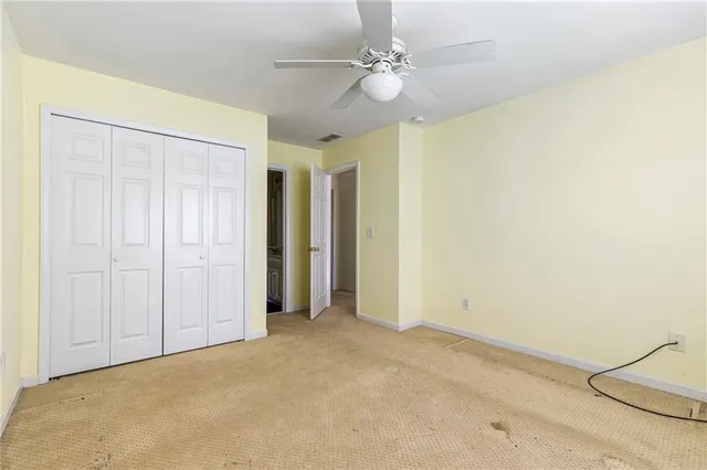 a bedroom with a bed and a table