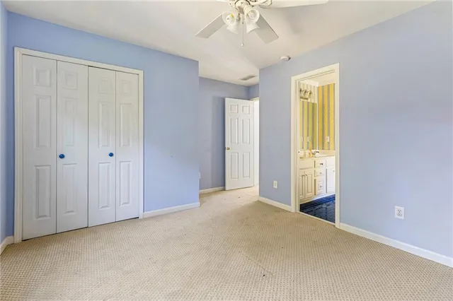 a living room with hard wood floors a table and a wooden floor