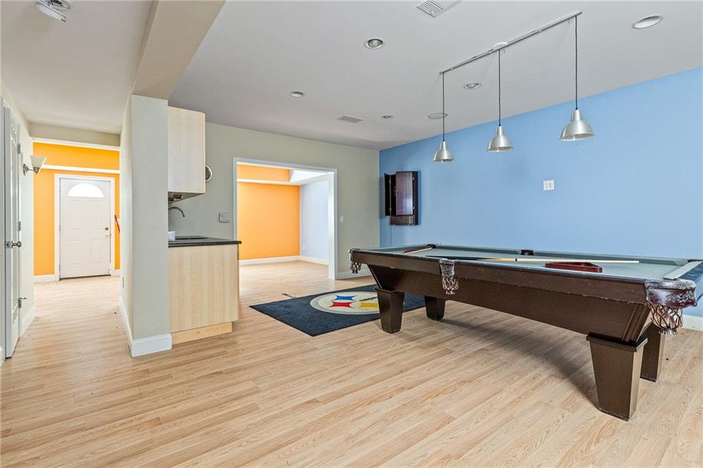 1355 Chattahoochee Run Drive Suwanee, GA 30024 - Photo 33 of 57 a reading room with furniture and wooden floor