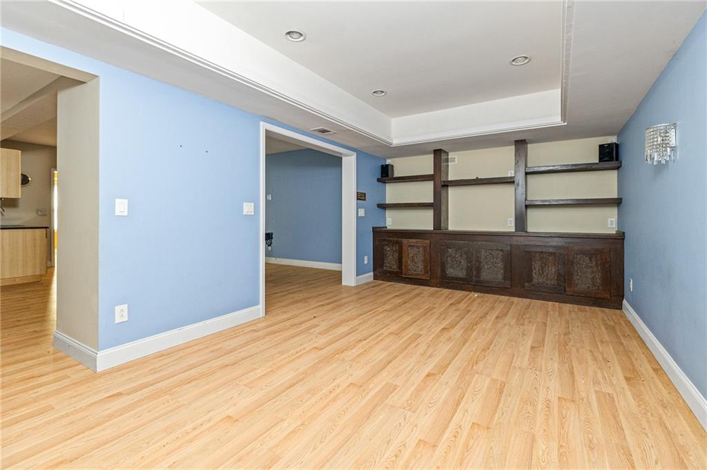 1355 Chattahoochee Run Drive Suwanee, GA 30024 - Photo 35 of 57 wooden floor in an empty room with a window