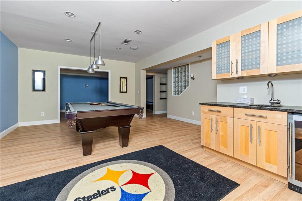 1355 Chattahoochee Run Drive Suwanee, GA 30024 - Photo 37 of 57 a living room with furniture and wooden floor