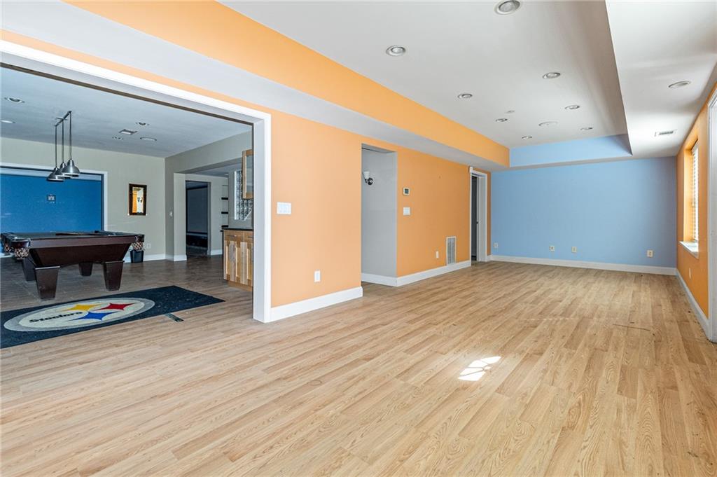 1355 Chattahoochee Run Drive Suwanee, GA 30024 - Photo 39 of 57 a view of room with furniture and wooden floor