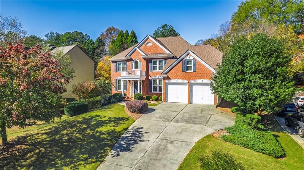 1355 Chattahoochee Run Drive Suwanee, GA 30024 - Photo 41 of 57 a front view of a house with a yard