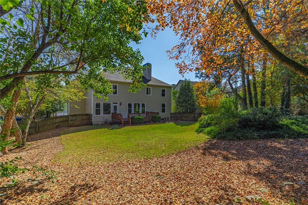1355 Chattahoochee Run Drive Suwanee, GA 30024 - Photo 43 of 57 a front view of a house with garden