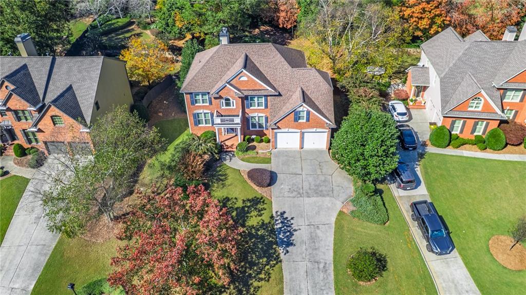 1355 Chattahoochee Run Drive Suwanee, GA 30024 - Photo 51 of 57 an aerial view of a house with swimming pool and garden