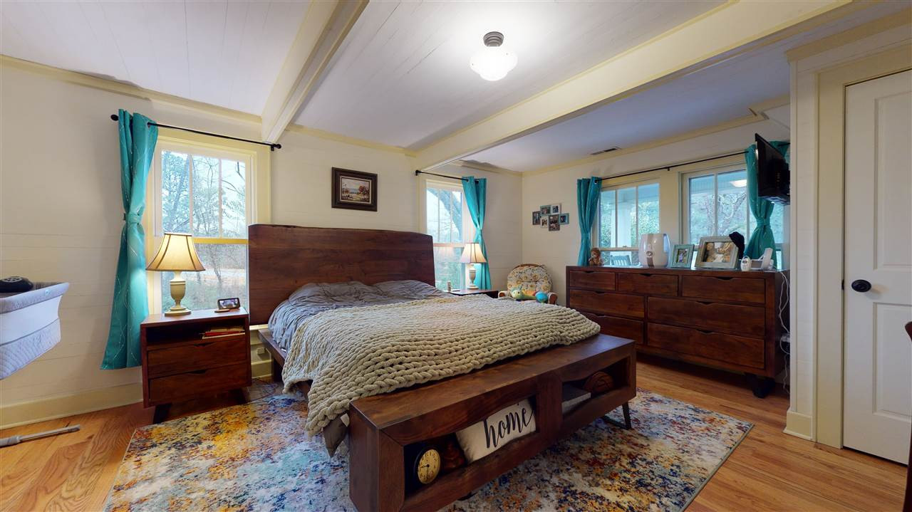 4007 Redwood Road Durham, NC 27704 - Photo 22 of 30 Well appointed owner's bedroom has tall ceilings, hardwood floors and an ensuite full bathroom. Owner's Bedroom