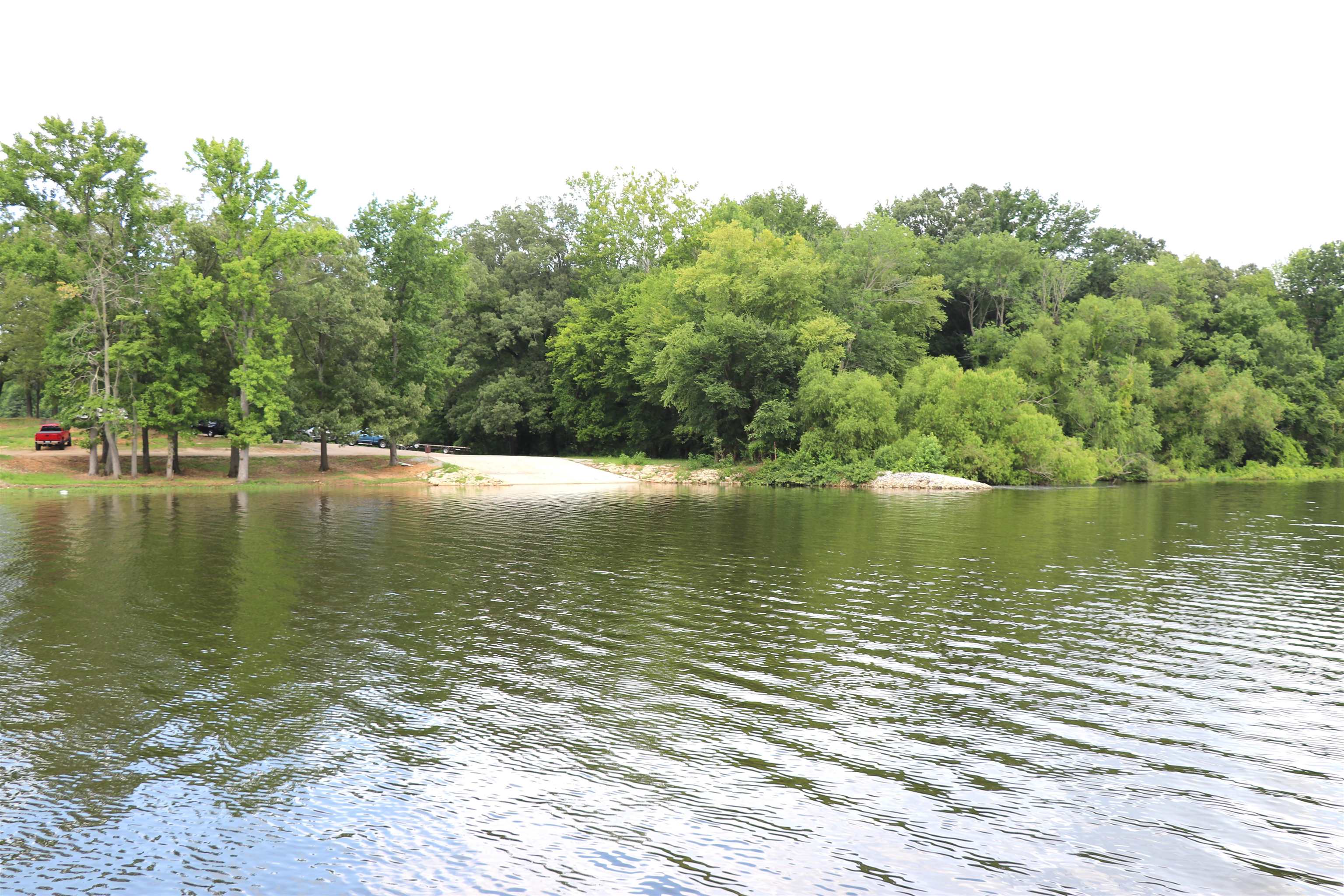 160 Patrick Drive Springville, TN 38256 - Photo 33 of 34 Expansive waterfront property featuring a boat launch, mature trees, and a gravel access area
