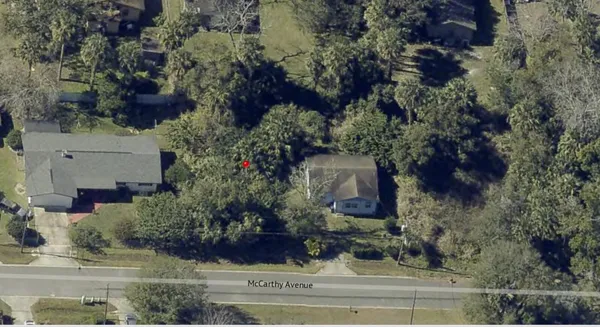 an aerial view of house with yard