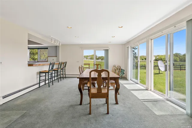 a view of a dining room with furniture window and outside view