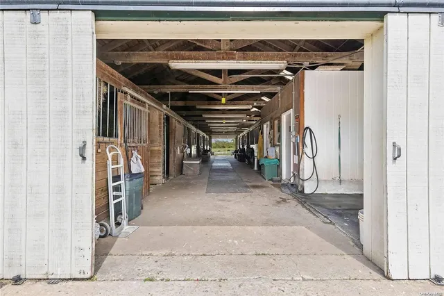 a view of a garage with wooden floors