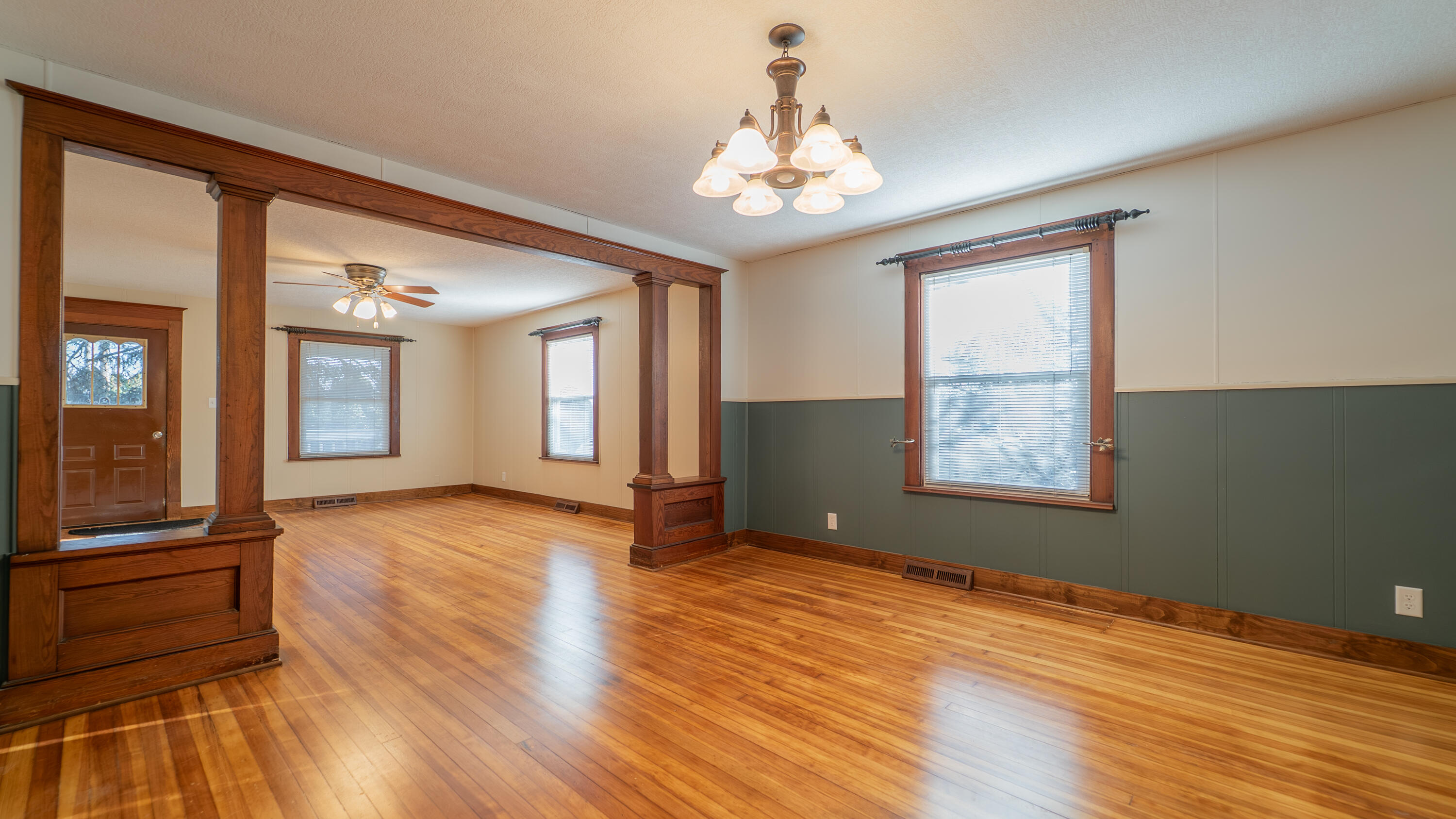 1013 Merrillville Road Crown Point, IN 46307 - Photo 11 of 36 a view of an empty room with wooden floor and a window