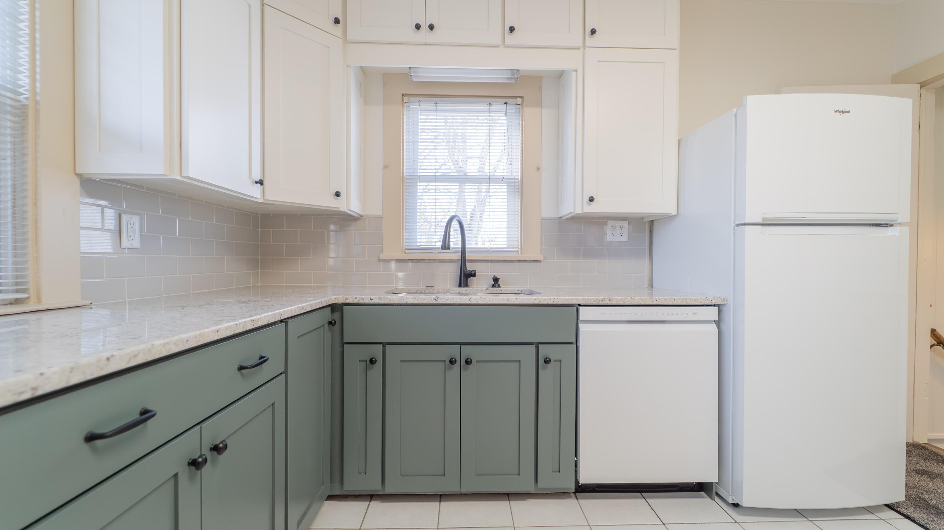 1013 Merrillville Road Crown Point, IN 46307 - Photo 12 of 36 a kitchen with a sink cabinets and a refrigerator