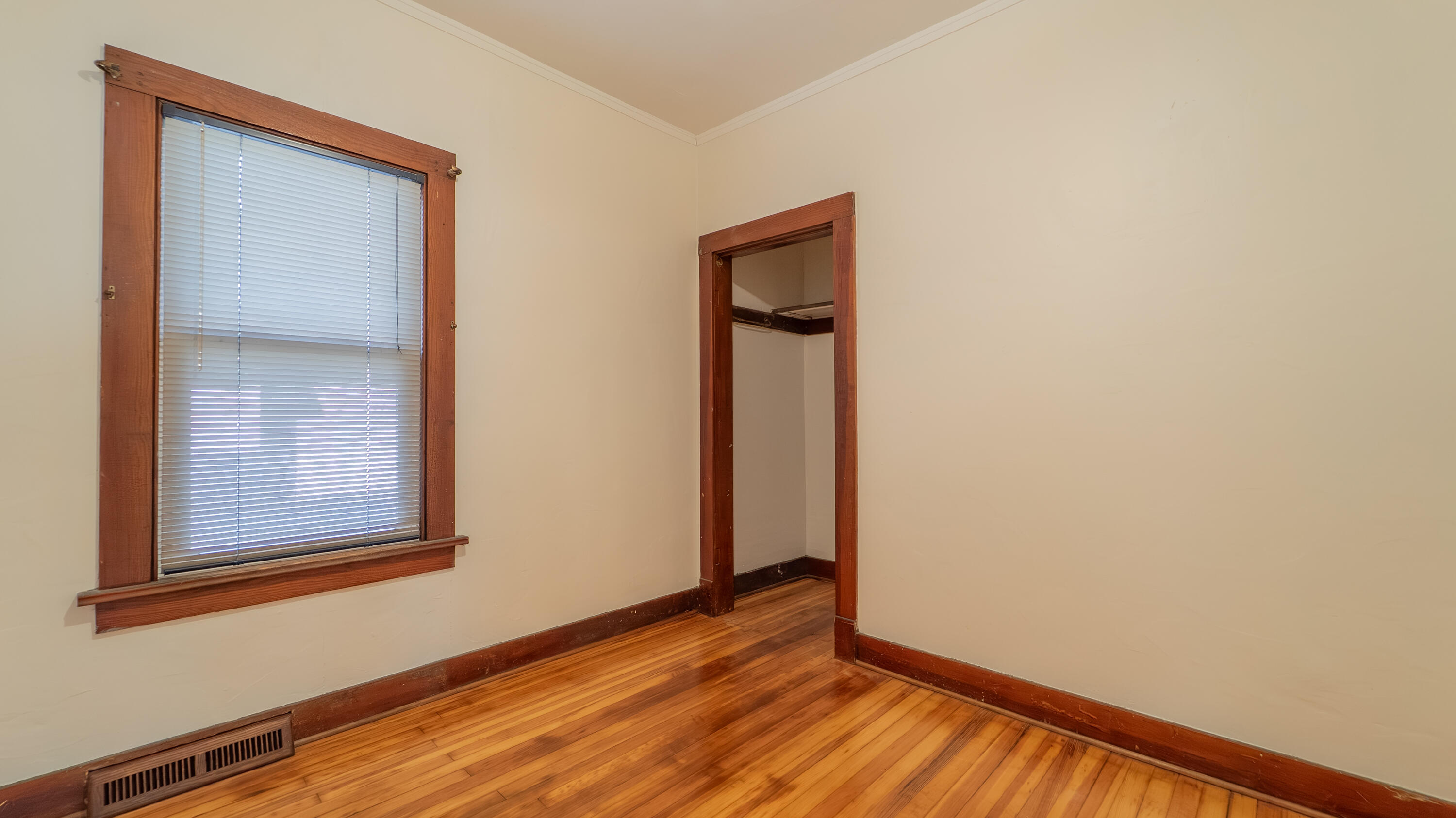 1013 Merrillville Road Crown Point, IN 46307 - Photo 17 of 36 a view of an empty room with wooden floor and a window
