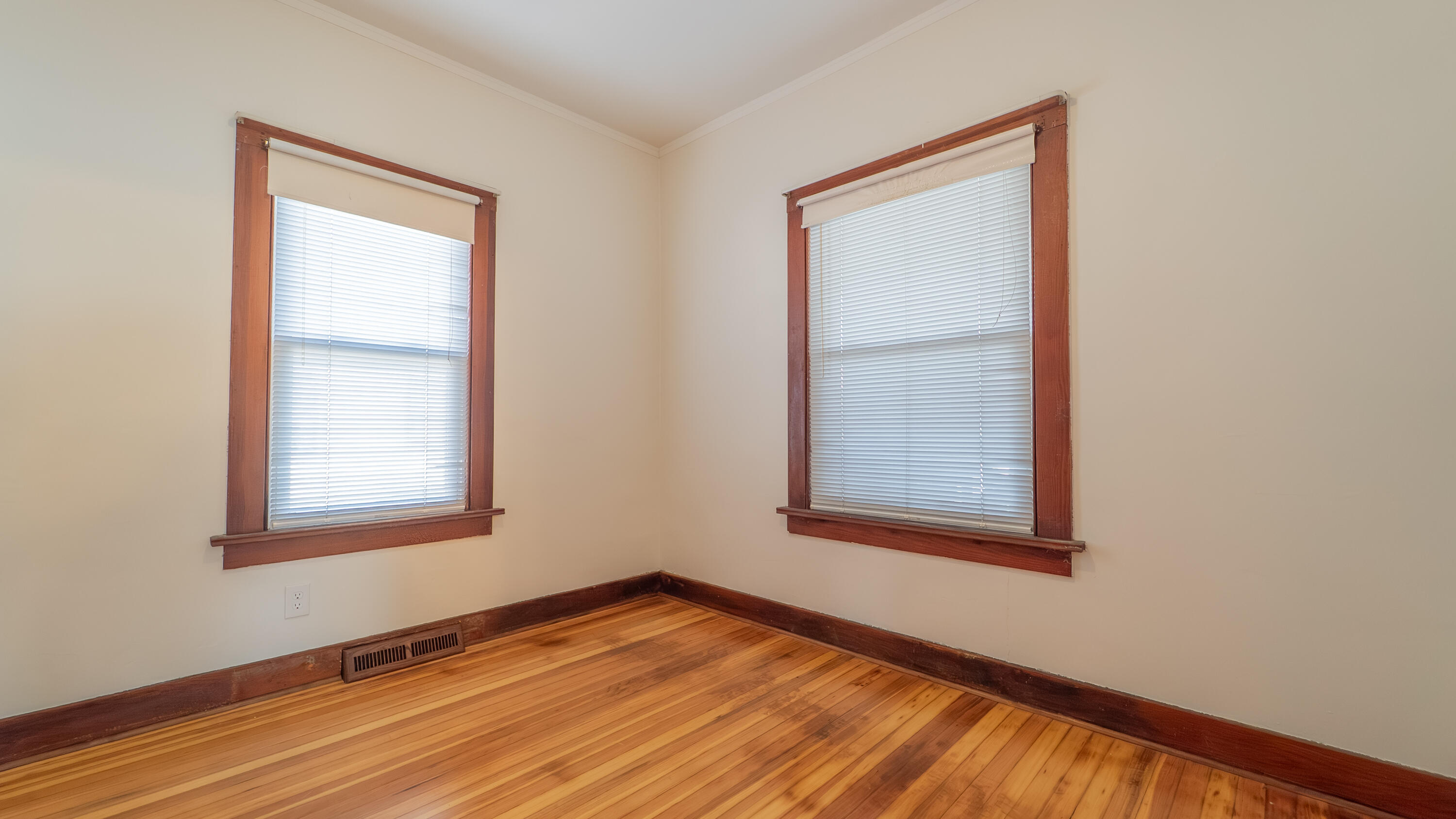 1013 Merrillville Road Crown Point, IN 46307 - Photo 21 of 36 a view of an empty room with wooden floor and a window