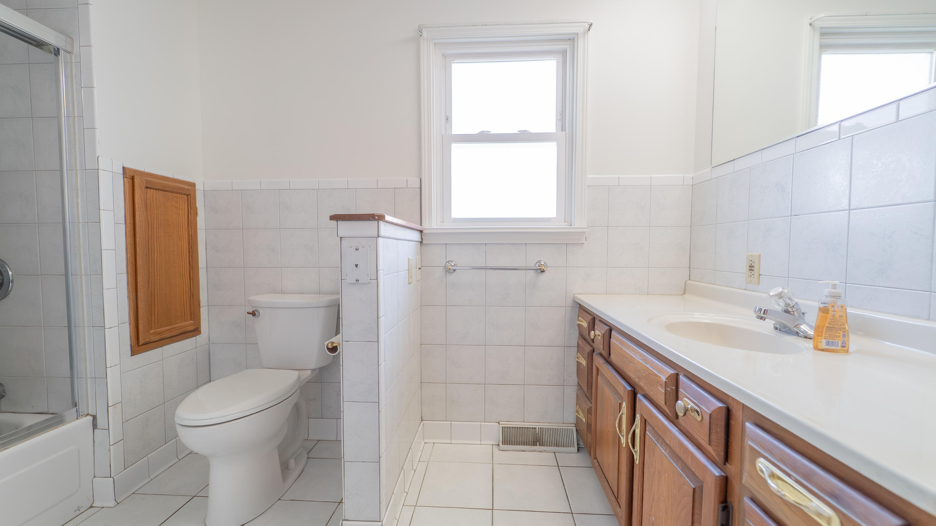 1013 Merrillville Road Crown Point, IN 46307 - Photo 23 of 36 a bathroom with a sink toilet and shower