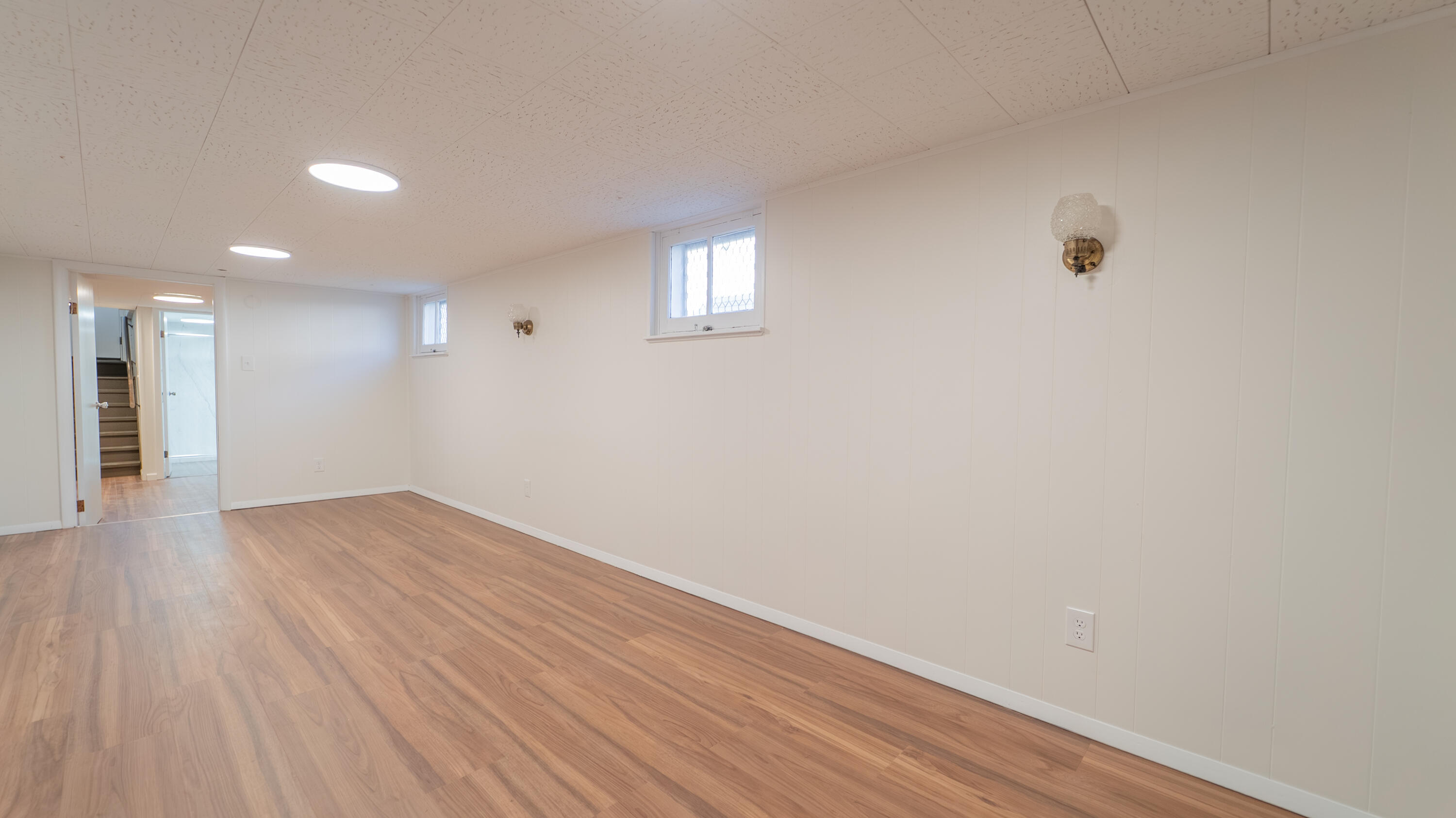 1013 Merrillville Road Crown Point, IN 46307 - Photo 32 of 36 a view of an empty room with wooden floor and a window