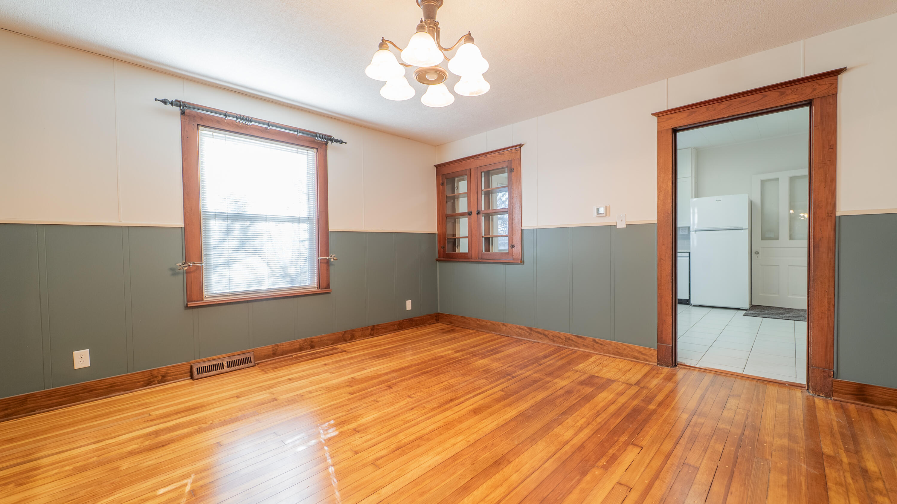 1013 Merrillville Road Crown Point, IN 46307 - Photo 10 of 36 a view of empty room with window and wooden floor