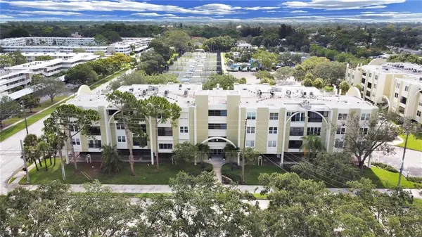 a view of multiple houses with a yard