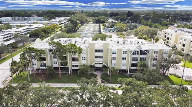 a view of multiple houses with a yard