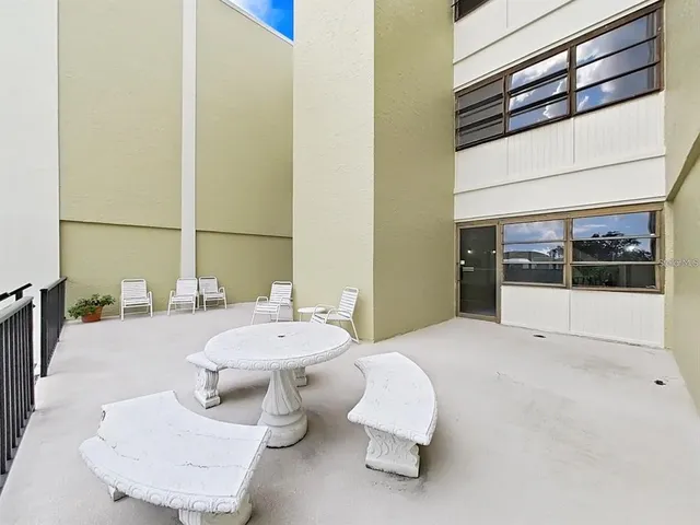 a living room with furniture and white walls