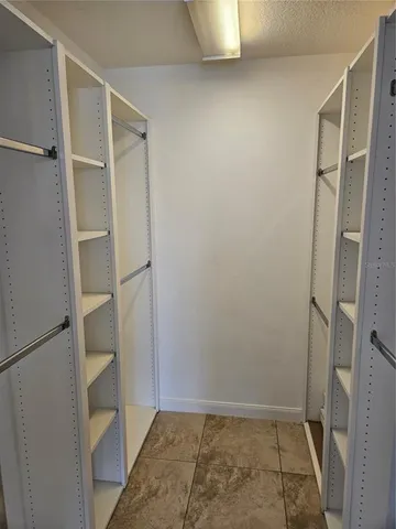 a bathroom with a shower sink vanity mirror and toilet