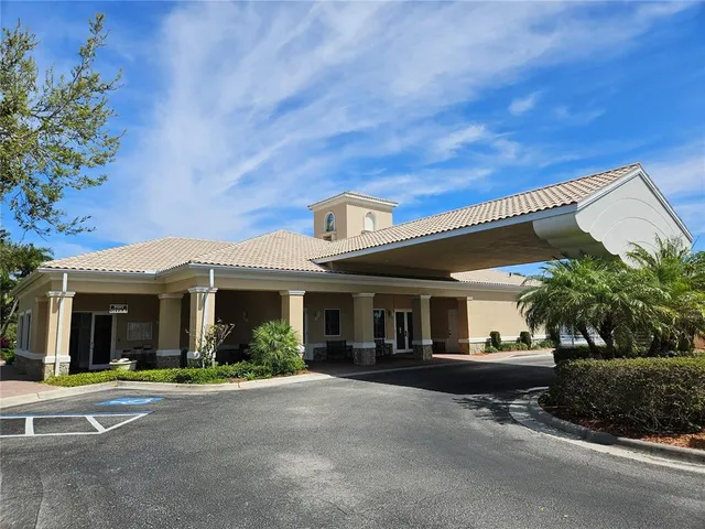 a view of a park with large trees