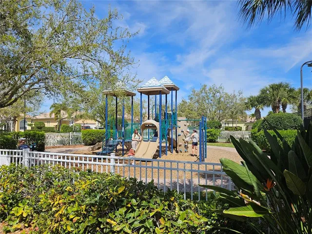 a view of a a dining room with furniture window and wooden floor