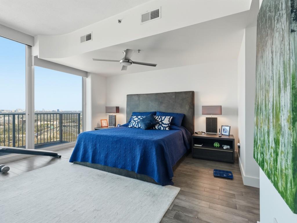 361 17th Street Northwest, Unit 2622 Atlanta, GA 30363 - Photo 12 of 35 a bedroom with a large bed and a large window