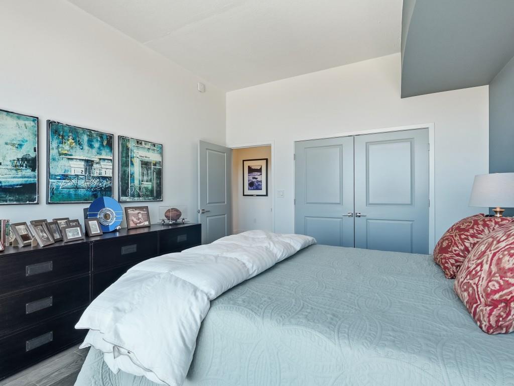 361 17th Street Northwest, Unit 2622 Atlanta, GA 30363 - Photo 18 of 35 a bedroom with a bed and a large window