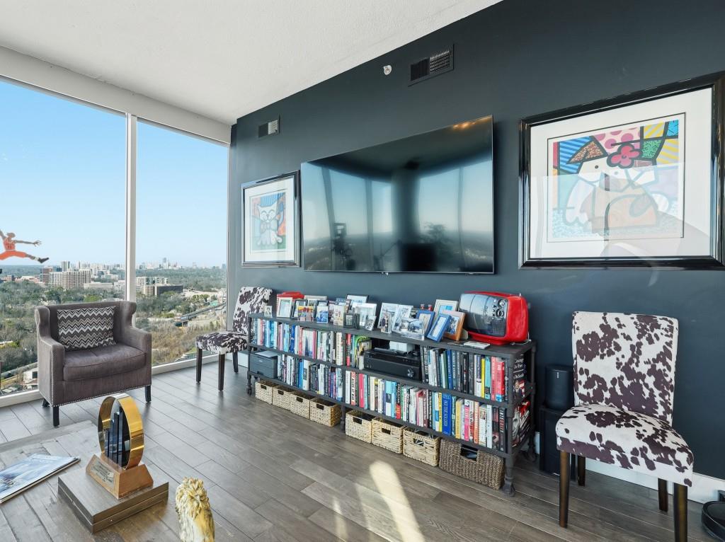 361 17th Street Northwest, Unit 2622 Atlanta, GA 30363 - Photo 29 of 35 a living room with lots of furniture and a wooden floor