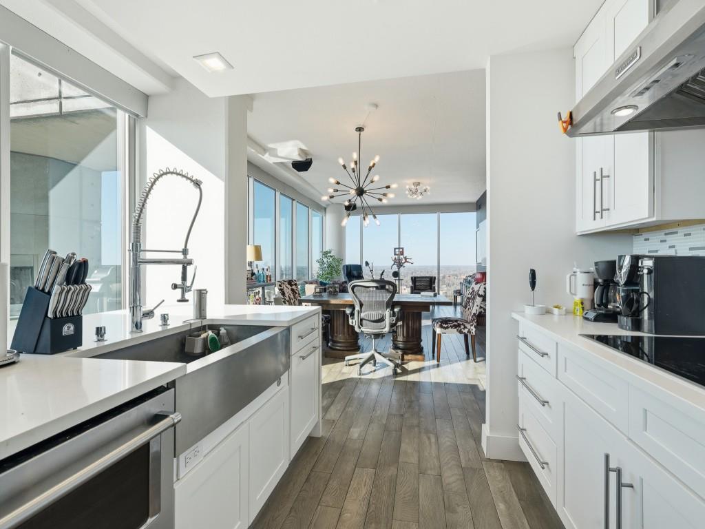 361 17th Street Northwest, Unit 2622 Atlanta, GA 30363 - Photo 30 of 35 a kitchen with counter top space a sink appliances and cabinets