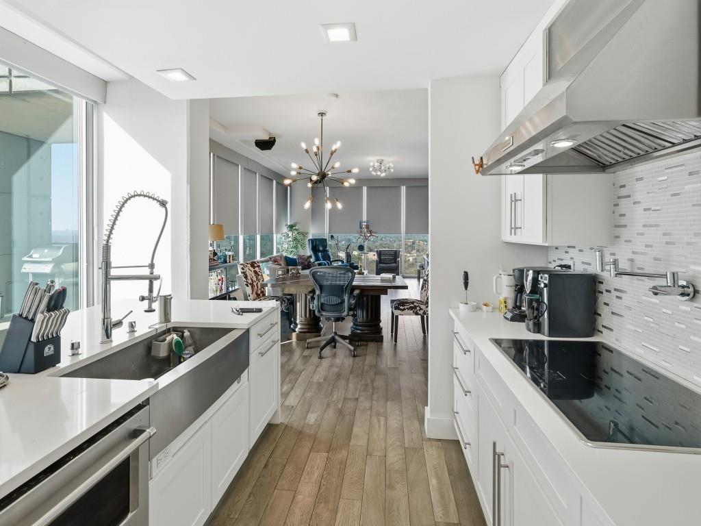 361 17th Street Northwest, Unit 2622 Atlanta, GA 30363 - Photo 7 of 35 a kitchen with counter top space a sink appliances and cabinets