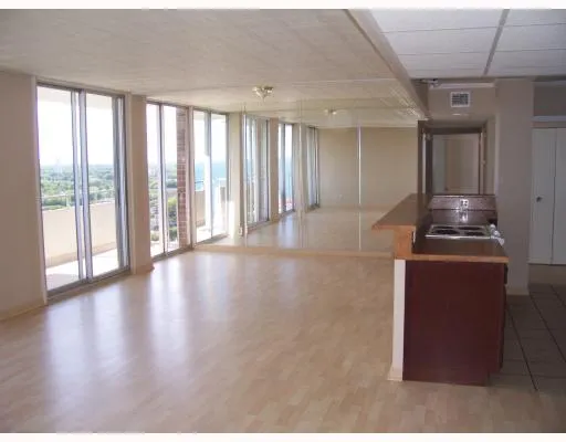 a kitchen with stainless steel appliances a refrigerator and a stove top oven