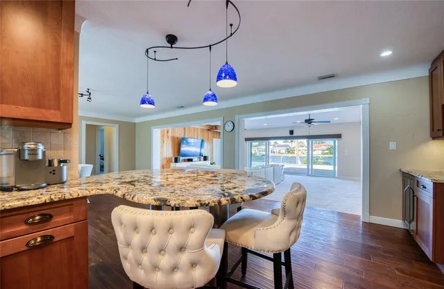 a hallway with wooden floor and doors