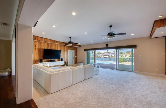 a view of a livingroom with furniture and a flat screen tv