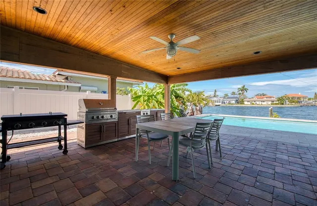 a view of a backyard with sitting area
