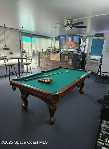 a view of kitchen with cabinets