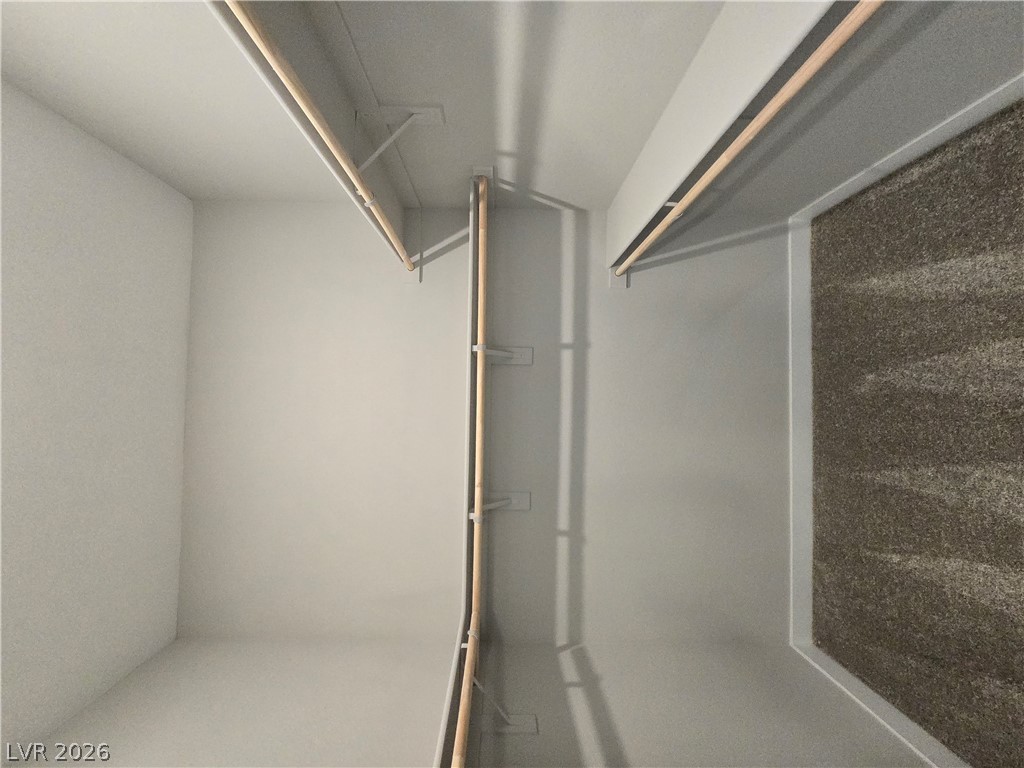 852 Weston Ridge Street Henderson, NV 89011 - Photo 18 of 28 Customizable closet space with ample hanging rods and integrated shelving.