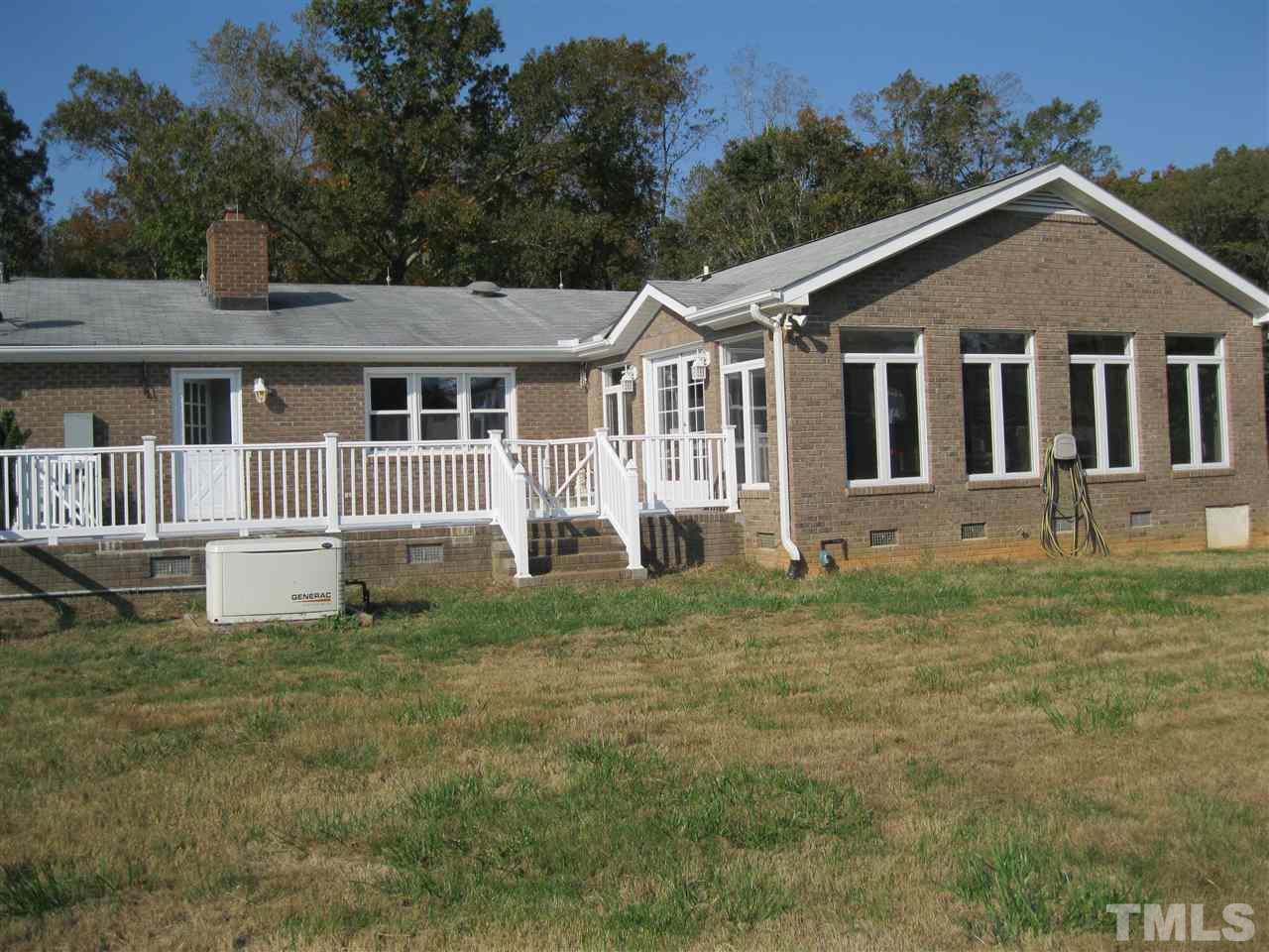 6107 Jackson Road Rougemont, NC 27572 - Photo 3 of 25 a front view of a house with a yard