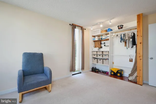 a living room with furniture and white walls