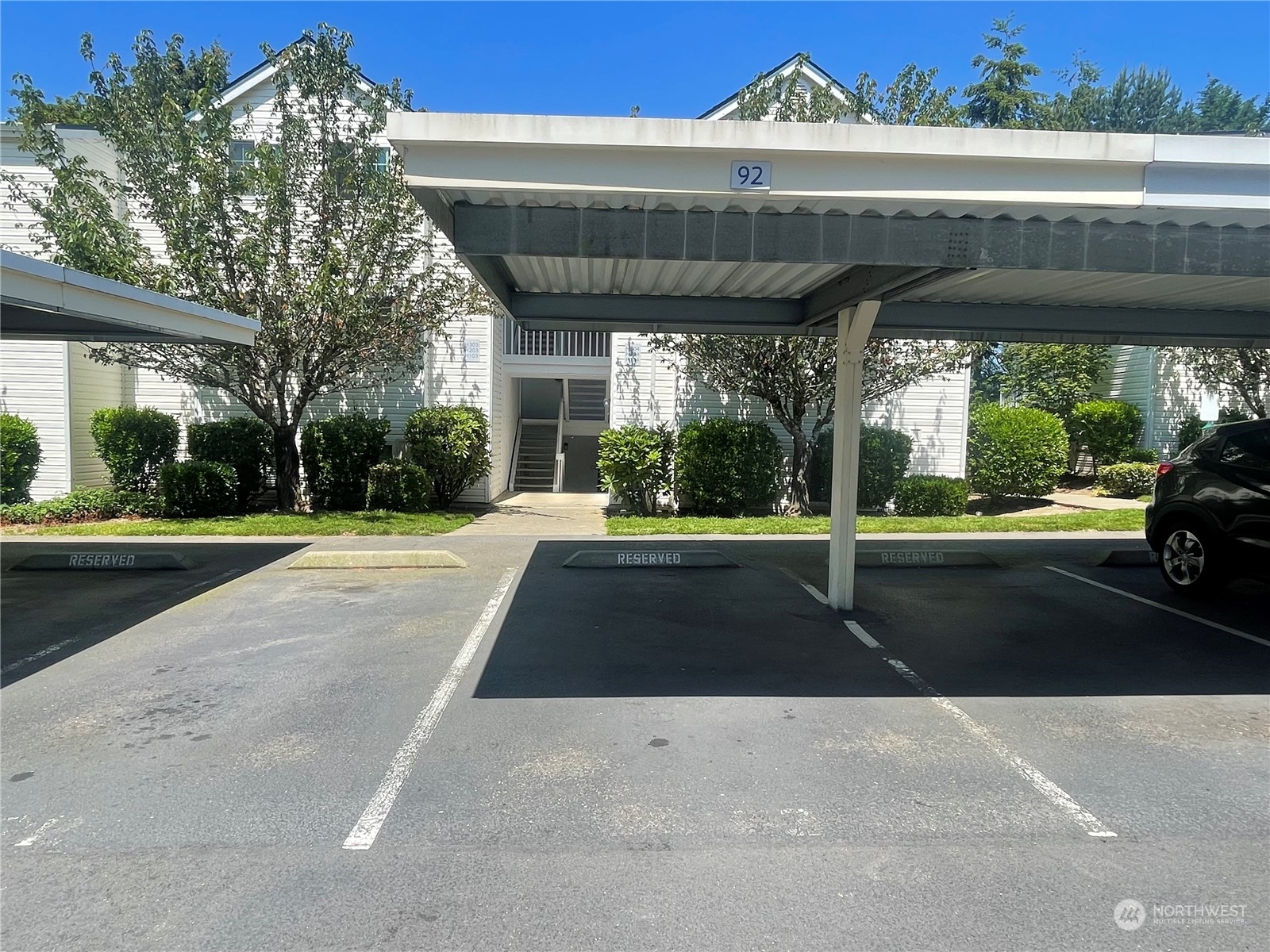 11002 Southeast Petrovitsky Road, Unit H103 Renton, WA 98055 - Photo 15 of 20 a view of building with car parked
