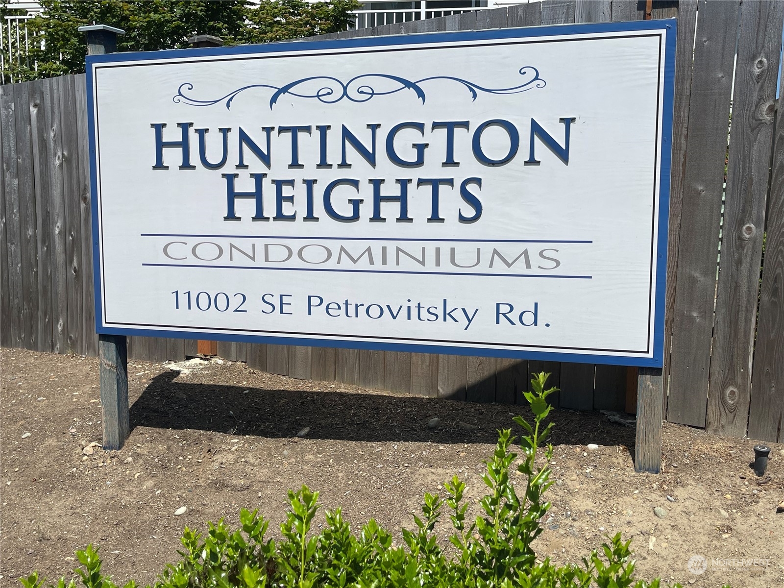 11002 Southeast Petrovitsky Road, Unit H103 Renton, WA 98055 - Photo 20 of 20 a sign on the side of a building
