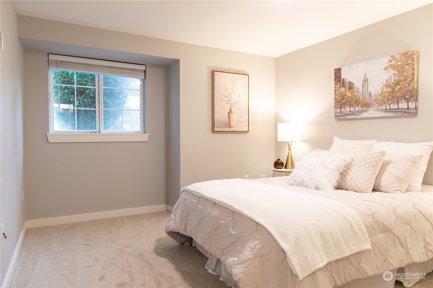 11002 Southeast Petrovitsky Road, Unit H103 Renton, WA 98055 - Photo 6 of 20 a bedroom with a bed and a window