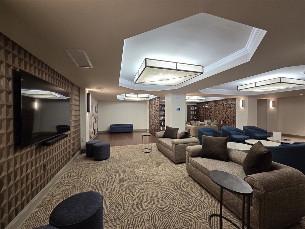 20 Chapel Street, Unit B811 Brookline, MA 02446 - Photo 36 of 41 a living room with furniture and a flat screen tv