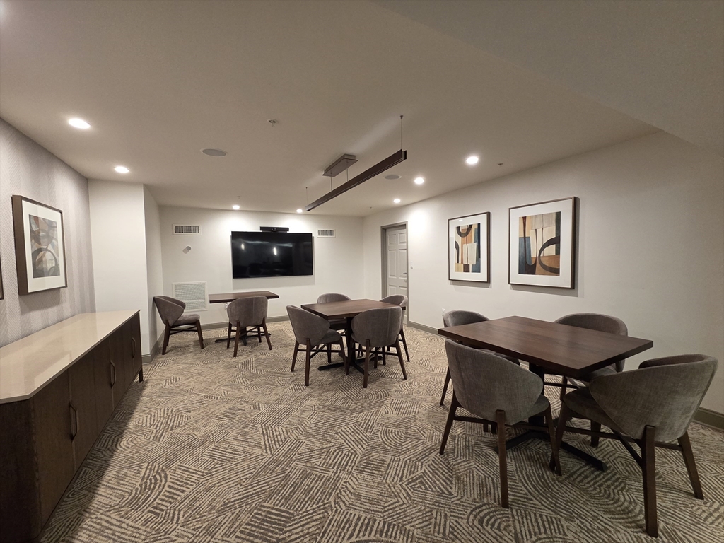 20 Chapel Street, Unit B811 Brookline, MA 02446 - Photo 38 of 41 a view of a dining room with furniture