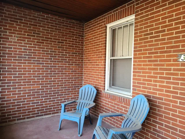 a view of a chair in wooden floor
