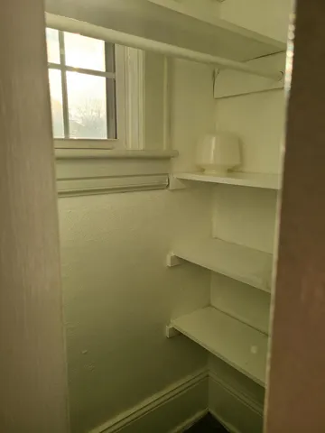 a view of storage and utility room with cabinet