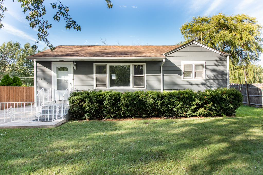 1636 Rice Street Waukegan, IL 60087 - Photo 2 of 26 a front view of a house with a yard