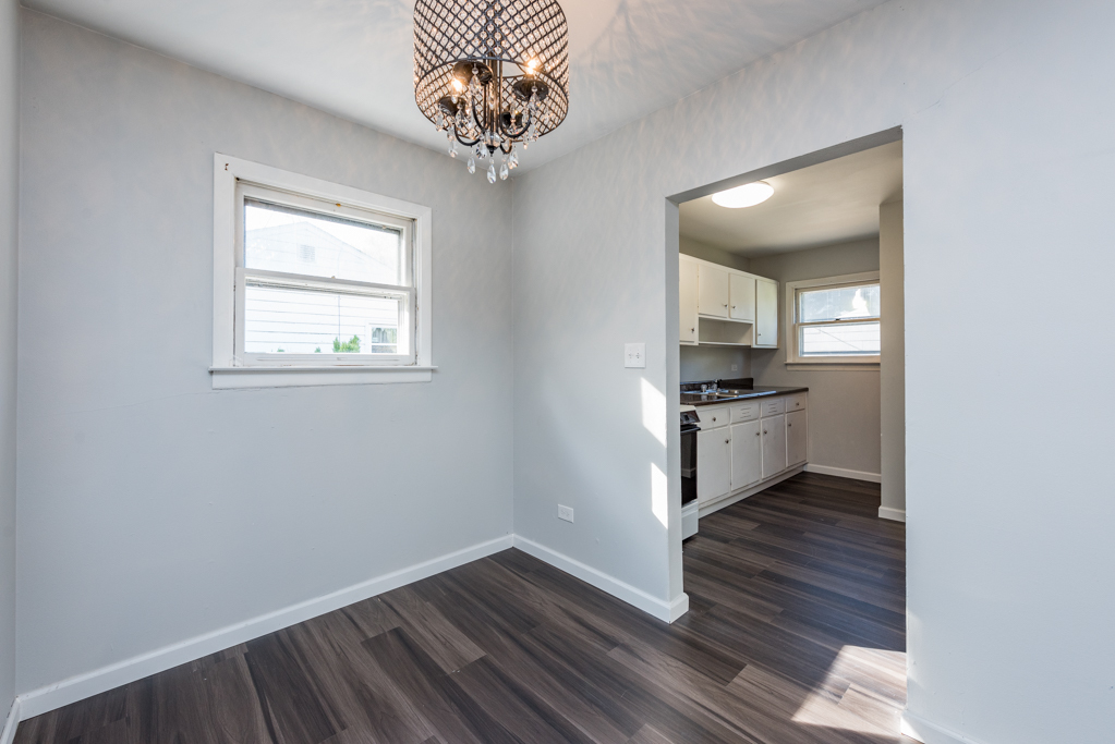 1636 Rice Street Waukegan, IL 60087 - Photo 11 of 26 a kitchen with a refrigerator and a stove top oven